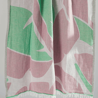 Turkish Beach Towel featuring a vibrant leaf pattern in greens and pinks