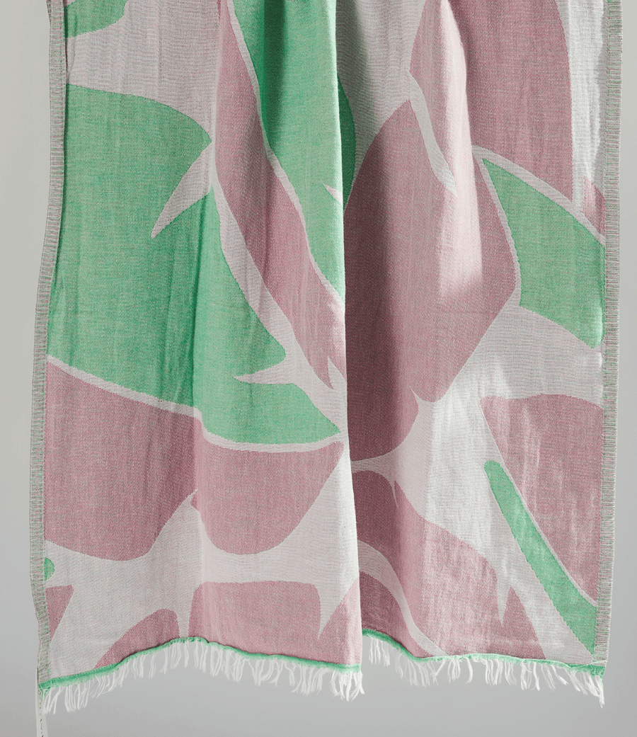 Turkish Beach Towel featuring a vibrant leaf pattern in greens and pinks
