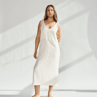 Soft cotton dress with tied straps, showcasing elegant design and breathable fabric for comfortable wear.