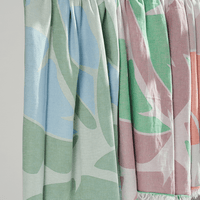 Pastel coloured Turkish Beach Towels featuring leaf patterns in blue, green, and pink