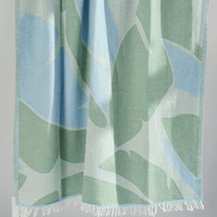 Turkish Beach Towel featuring a lush leaf pattern in greens and blues
