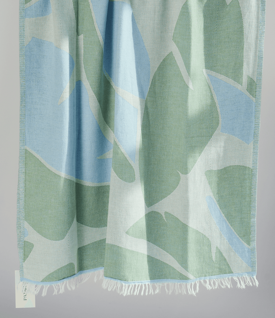 Turkish Beach Towel featuring a lush leaf pattern in greens and blues