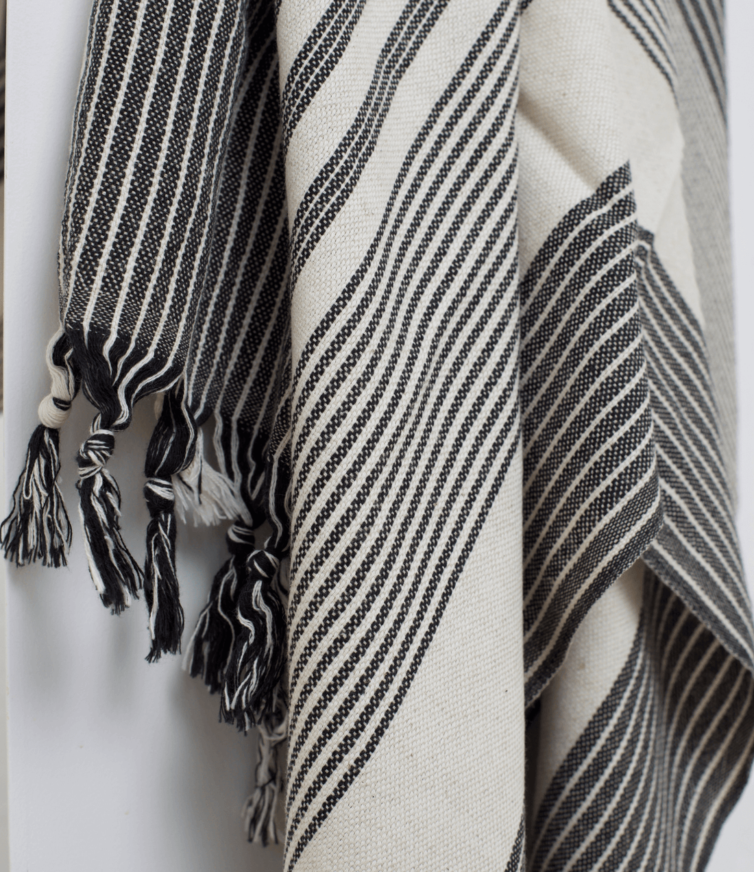 A premium linen "Kekova" Turkish towel in Black & Beige stripe