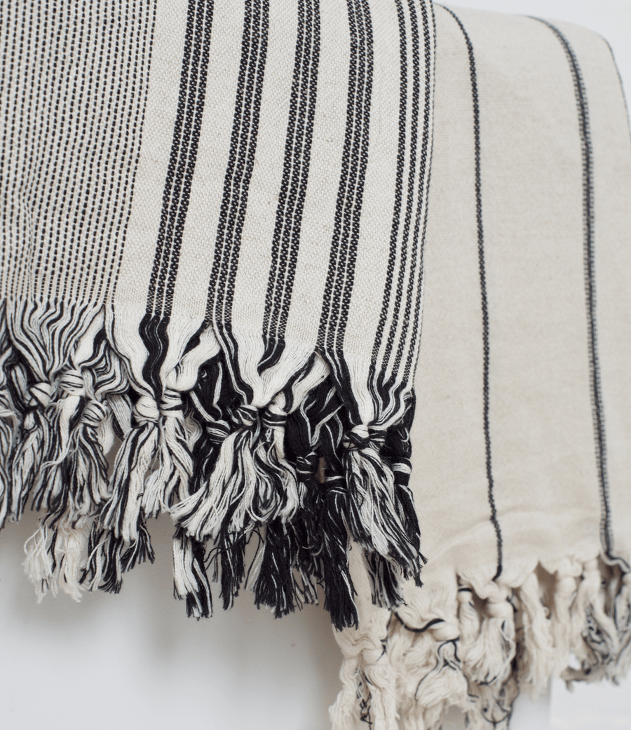 Two premium linen "Kekova" Turkish towels. One in Beige with black stripes and Black & Beige stripe